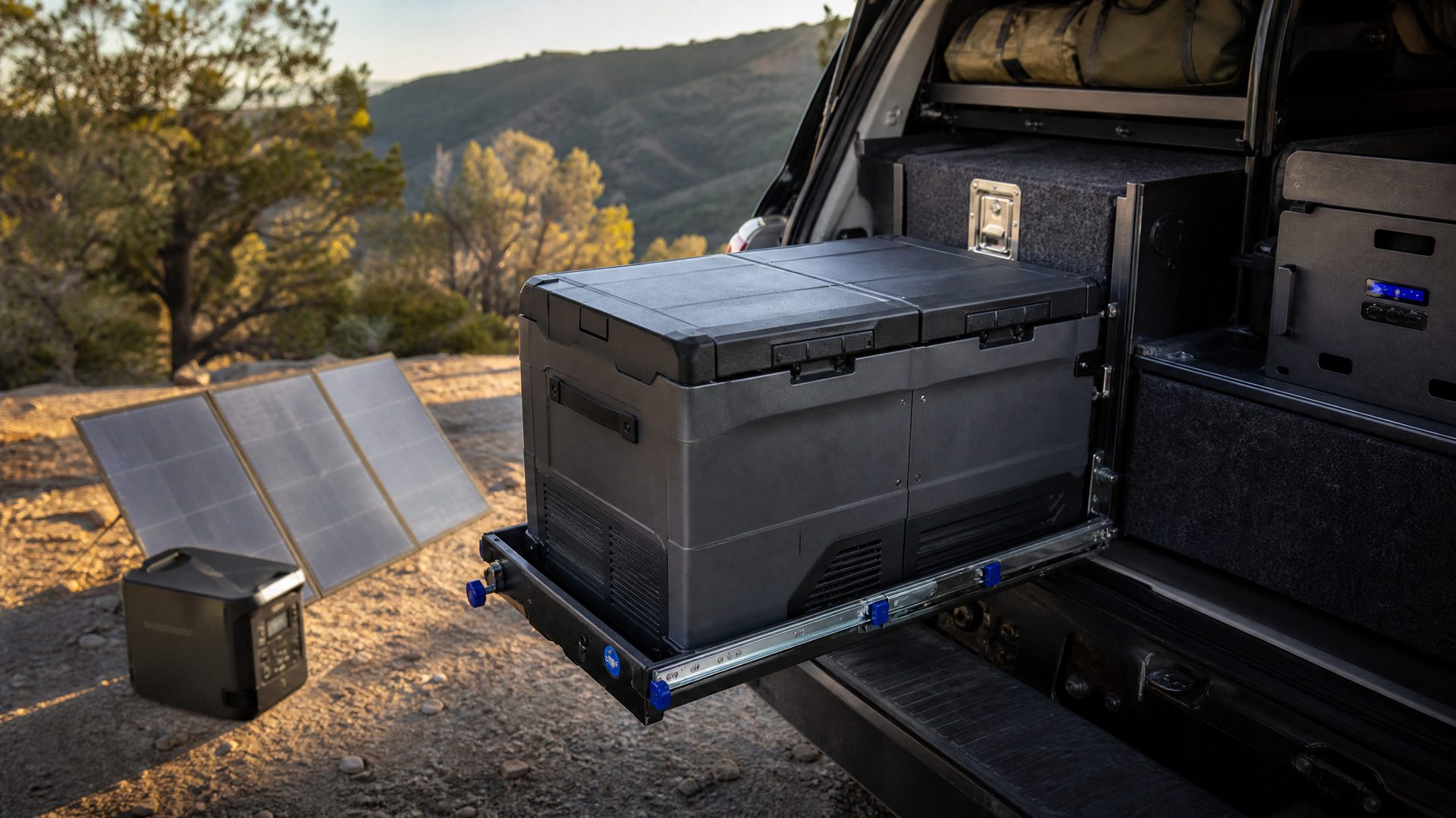 Dual-zone camping fridge on a 4x4 slide-out tray for off-grid touring