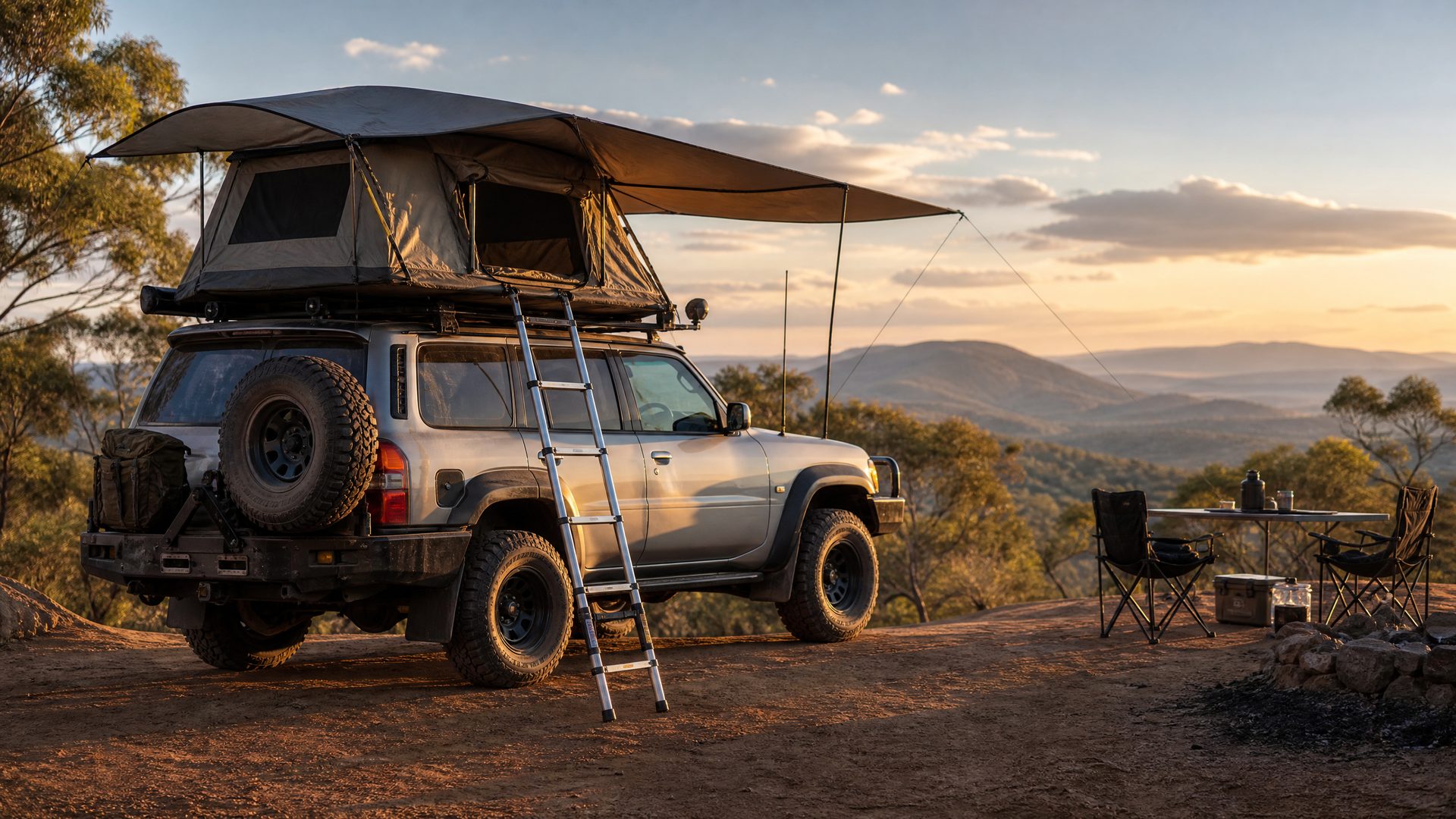 Rooftop tent deployed on a touring 4x4 at a scenic bush campsite
