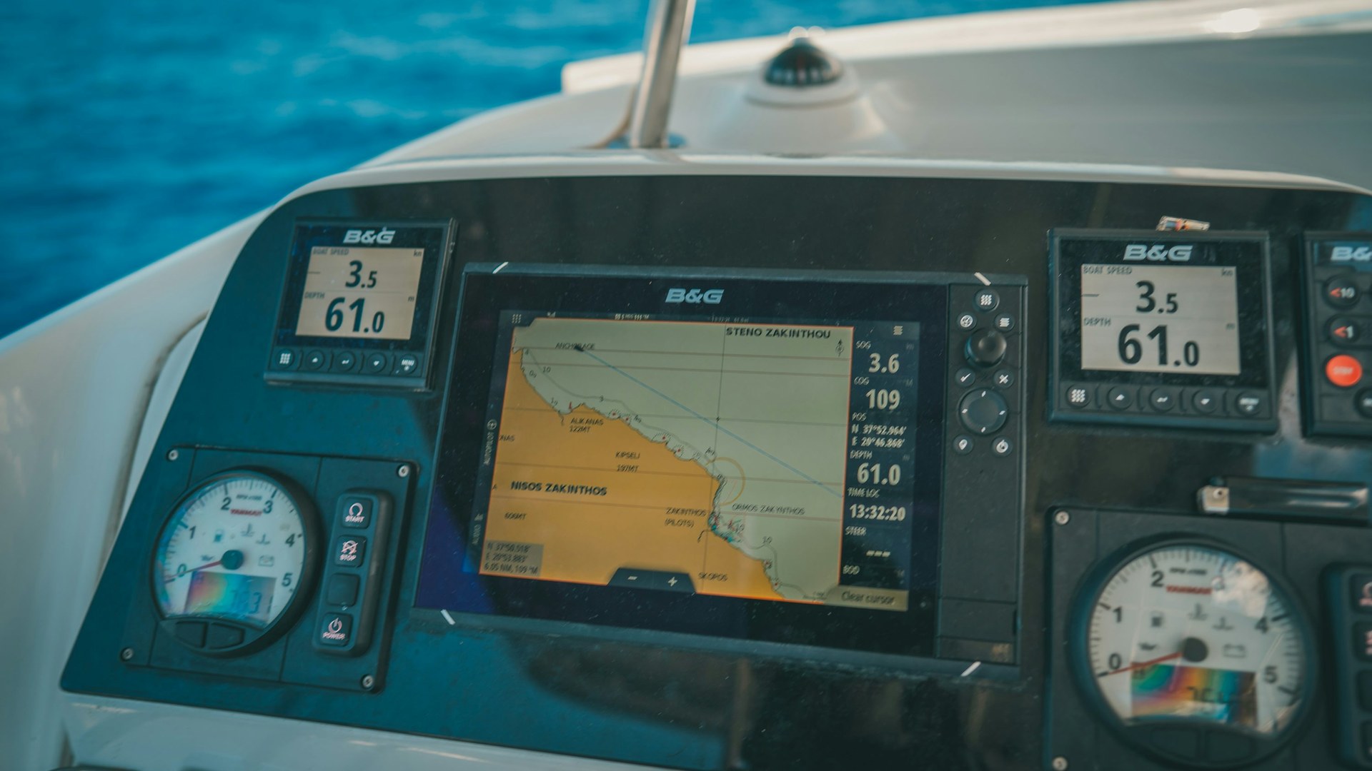 Fish finder and GPS electronics mounted at a boat helm
