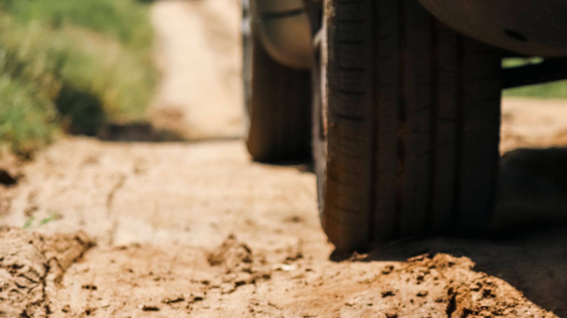 Close-up of a 4x4 tyre on a dirt track